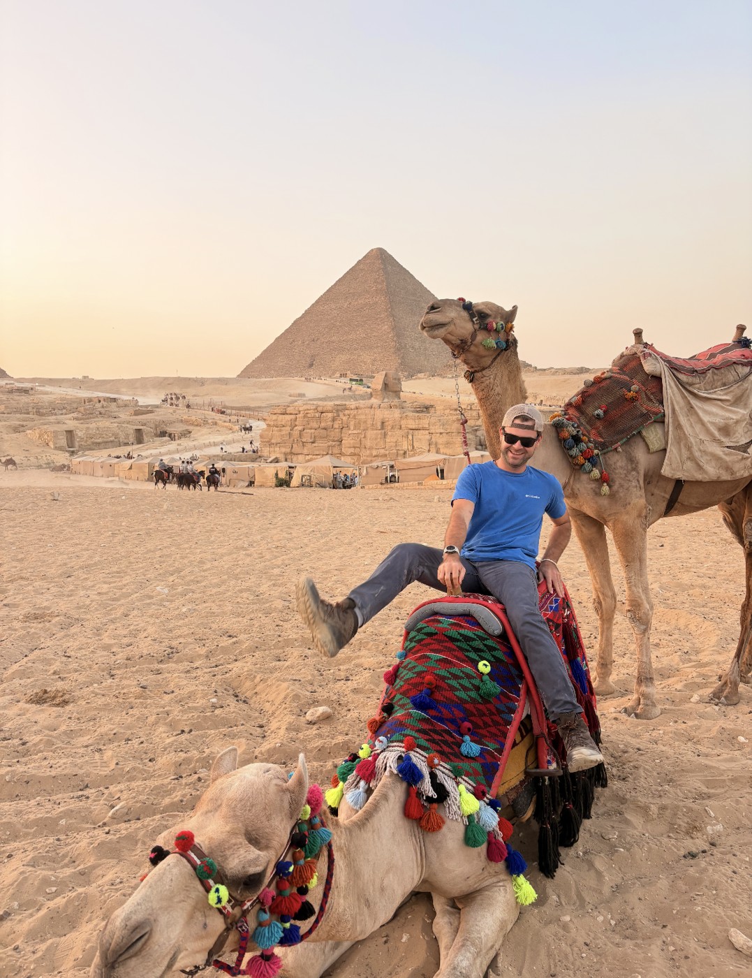 Riding camels at the pyramids of Giza