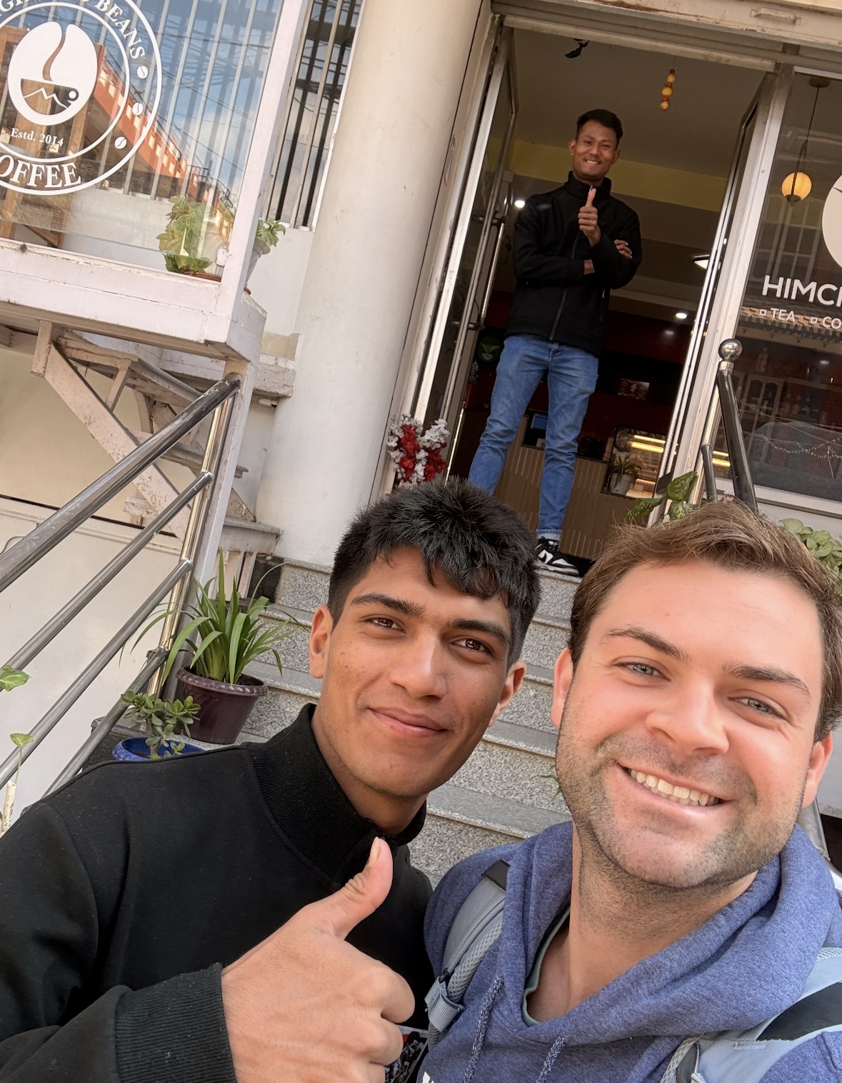 New friends outside a coffee shop in Kathmandu